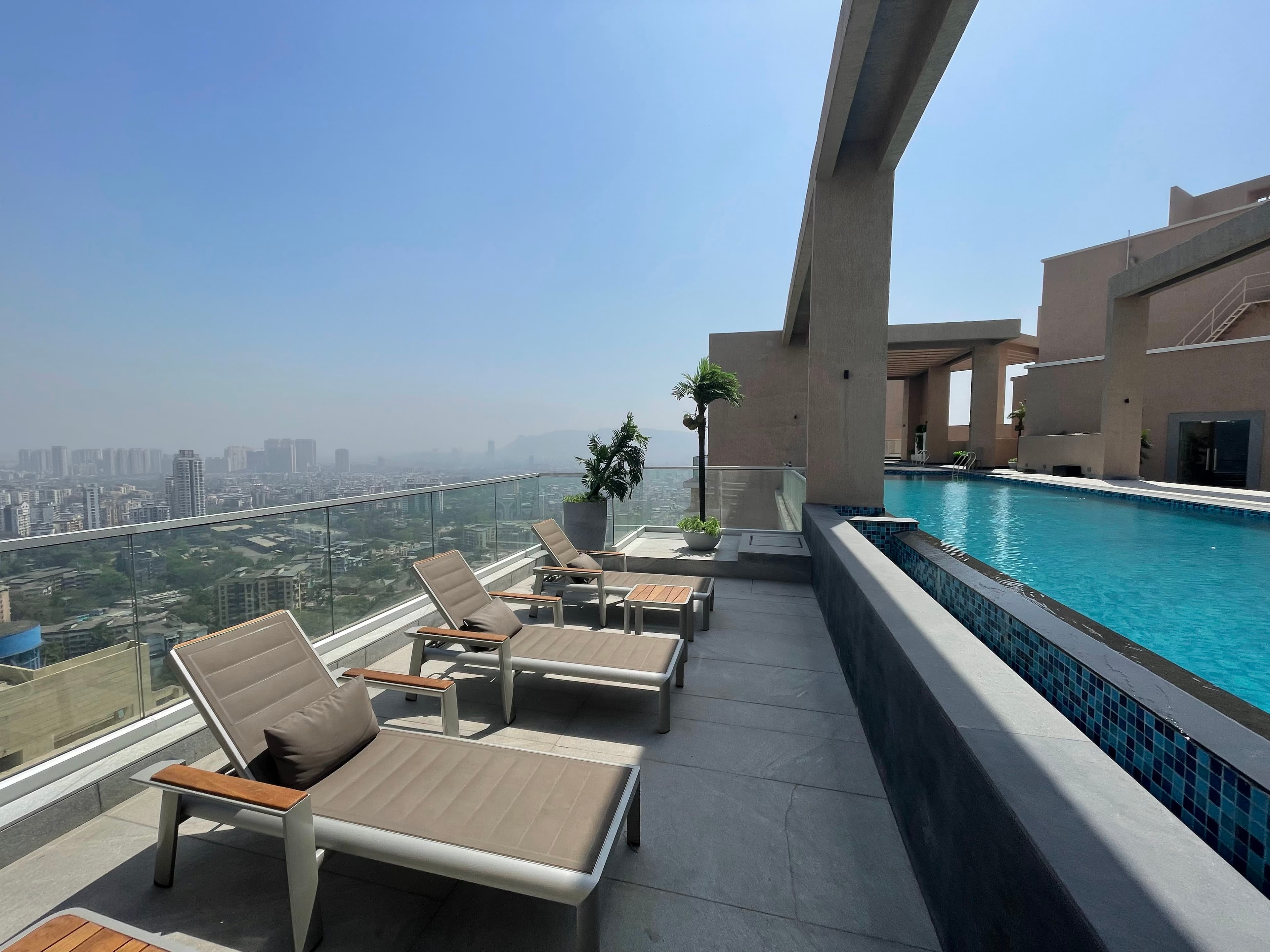 Sleek View Terrace Glass Railing: Enhance Your Space with Uninterrupted Swimming Pool Views